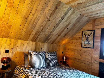 Un ou plusieurs lits dans un hébergement de l'établissement Chalet avec jacuzzi privé, vue sur les Vosges