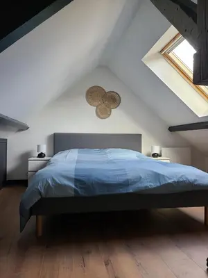 Un ou plusieurs lits dans un hébergement de l'établissement Beau duplex avec garage