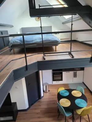 Un ou plusieurs lits dans un hébergement de l'établissement Beau duplex avec garage