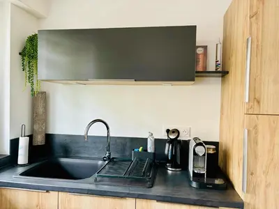 Cuisine ou kitchenette dans l'établissement Appartement de standing proche centre ville et gare