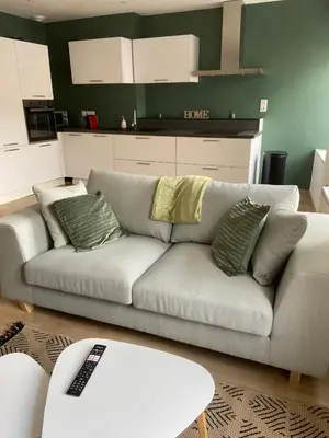 Coin salon dans l'établissement Appartement de la Place
