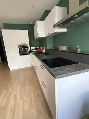 Cuisine ou kitchenette dans l'établissement Appartement de la Place