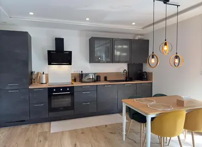 Cuisine ou kitchenette dans l'établissement Zen&spa appartement avec jacuzzi et sauna privatif