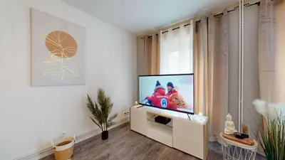 Télévision ou salle de divertissement dans l'établissement Appartement Le Key6
