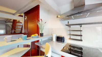 Cuisine ou kitchenette dans l'établissement Triplex Le Bel Âtre