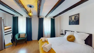 Un ou plusieurs lits dans un hébergement de l'établissement Triplex Le Bel Âtre