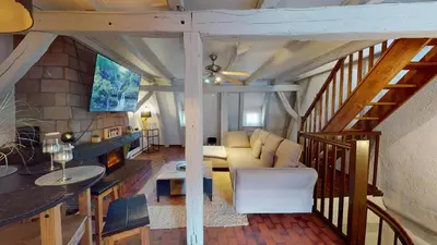 Coin salon dans l'établissement Triplex Le Bel Âtre