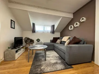 Coin salon dans l'établissement Le Sochalien - Appt 6 pers - Tout confort - Proche Peugeot