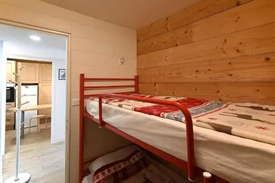 Un ou plusieurs lits dans un hébergement de l'établissement Pré Fleuri 2 - Vue Lac et Montagne, à 600m du lac