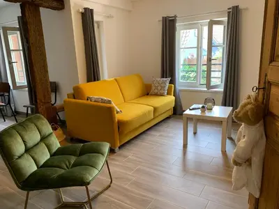 Coin salon dans l'établissement Gite Les Vendanges à Beblenheim Parking privé