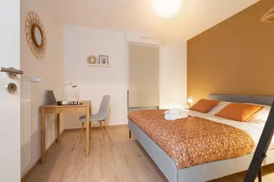 Un ou plusieurs lits dans un hébergement de l'établissement La belle vue