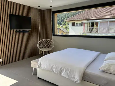 Télévision ou salle de divertissement dans l'établissement Le Grand Perce Neige & Jacuzzi à proximité de Gérardmer