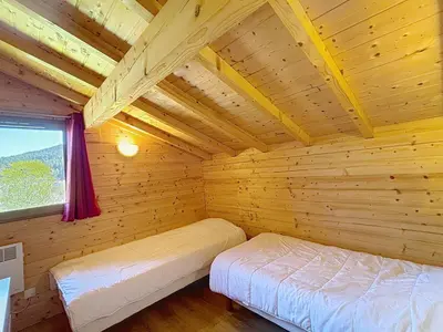 Un ou plusieurs lits dans un hébergement de l'établissement Chalet du Géhan