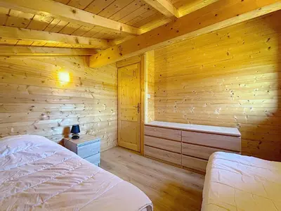 Un ou plusieurs lits dans un hébergement de l'établissement Chalet du Géhan