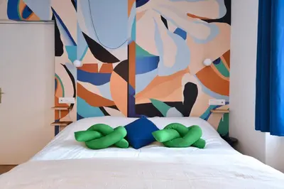 Un ou plusieurs lits dans un hébergement de l'établissement Gite See You Soon - Studio Wood