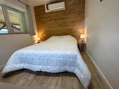 Un ou plusieurs lits dans un hébergement de l'établissement Gérardmer chalet le Belvédere vue lac, piste de ski