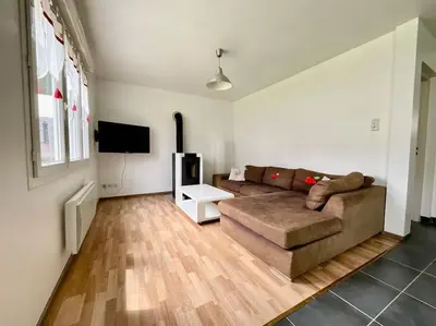 Coin salon dans l'établissement L'Appart du Lac de Gérardmer - Beau & spacieux
