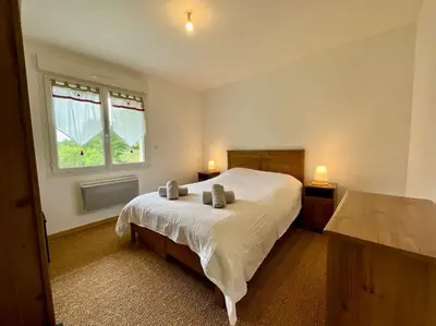 Un ou plusieurs lits dans un hébergement de l'établissement L'Appart du Lac de Gérardmer - Beau & spacieux