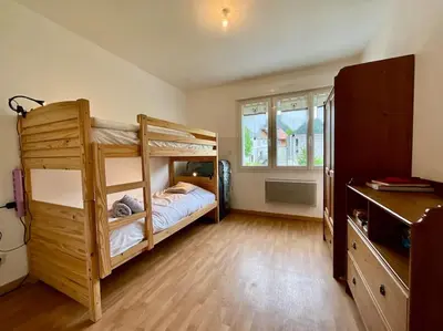 Un ou plusieurs lits dans un hébergement de l'établissement L'Appart du Lac de Gérardmer - Beau & spacieux