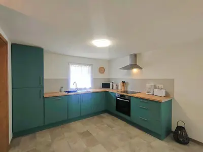 Cuisine ou kitchenette dans l'établissement Achille