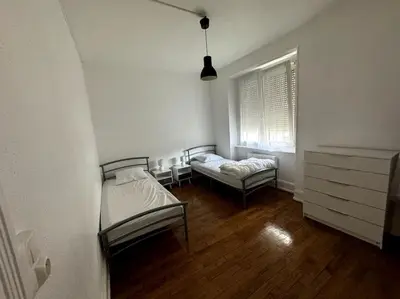 Un ou plusieurs lits dans un hébergement de l'établissement Appartement
