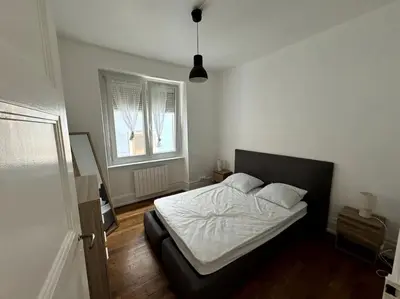 Un ou plusieurs lits dans un hébergement de l'établissement Appartement