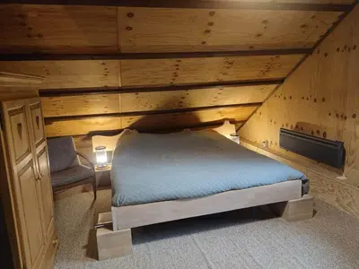 Un ou plusieurs lits dans un hébergement de l'établissement Chalet L'envolée Bleue