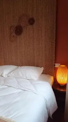 Un ou plusieurs lits dans un hébergement de l'établissement Le Physalis gîte tout confort