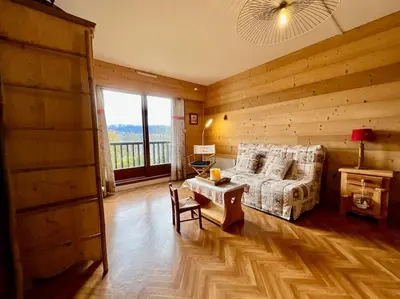 Un ou plusieurs lits dans un hébergement de l'établissement Les Xettes, bel appartement style chalet & balcon