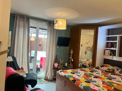 Un ou plusieurs lits dans un hébergement de l'établissement Studio la magie de Noël