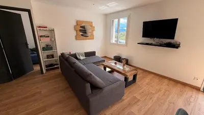 Télévision ou salle de divertissement dans l'établissement L Envol Maison Entière