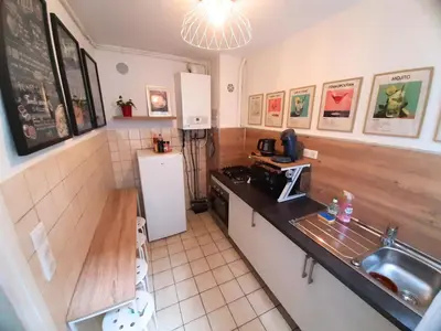 Cuisine ou kitchenette dans l'établissement La Bohème - Idéal familles, hyper centre