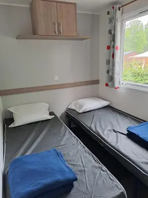 Un ou plusieurs lits dans un hébergement de l'établissement Mobile home