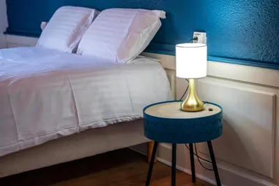 Un ou plusieurs lits dans un hébergement de l'établissement Le 42-GregIMMO-Appart'Hôtel