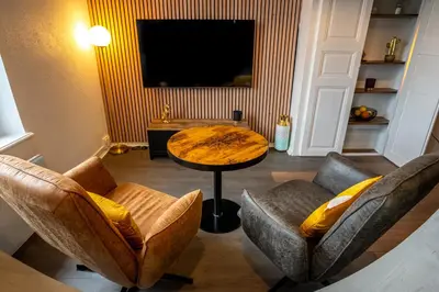Télévision ou salle de divertissement dans l'établissement Le 37-GregIMMO-Appart'Hôtel