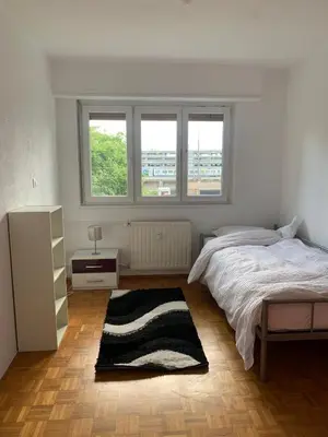 Un ou plusieurs lits dans un hébergement de l'établissement Appartement en face de la gare de St-Louis