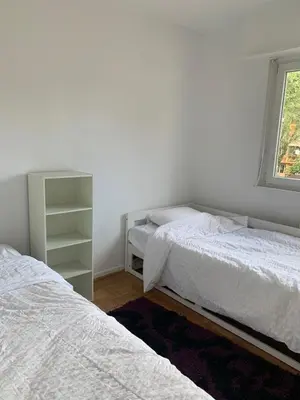 Un ou plusieurs lits dans un hébergement de l'établissement Appartement en face de la gare de St-Louis
