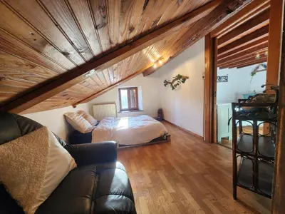 Coin salon dans l'établissement Maison de Vacances