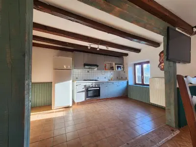Cuisine ou kitchenette dans l'établissement Maison de Vacances