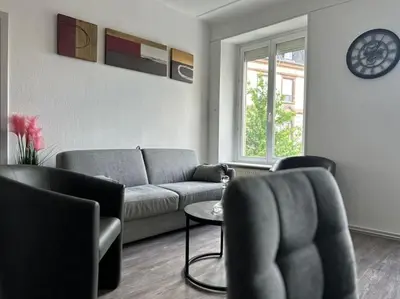 Coin salon dans l'établissement #Aujé - Appart Mulhouse Centre