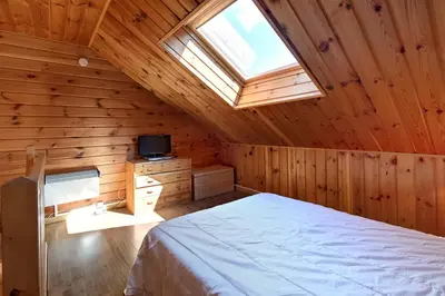Un ou plusieurs lits dans un hébergement de l'établissement Le Nid des Vosges - Appt vue montagne