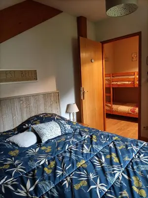 Un ou plusieurs lits dans un hébergement de l'établissement Appartement GERARDMER - Magnifique vue sur le lac - 2 adultes et 2 enfants maximum