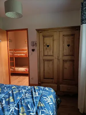Un ou plusieurs lits dans un hébergement de l'établissement Appartement GERARDMER - Magnifique vue sur le lac - 2 adultes et 2 enfants maximum