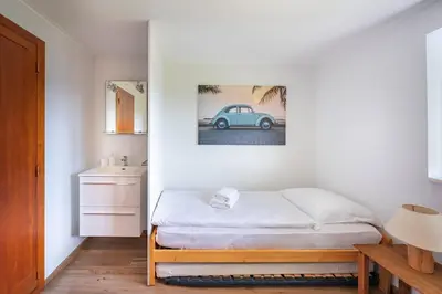 Un ou plusieurs lits dans un hébergement de l'établissement Chalet Les Genêts, vue imprenable sur le lac