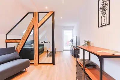 Coin salon dans l'établissement Appartements Les Vosges