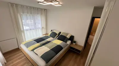 Un ou plusieurs lits dans un hébergement de l'établissement Room with double size bed in Kaysersberg center
