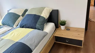 Un ou plusieurs lits dans un hébergement de l'établissement Room with double size bed in Kaysersberg center