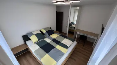 Un ou plusieurs lits dans un hébergement de l'établissement Room with double size bed in Kaysersberg center