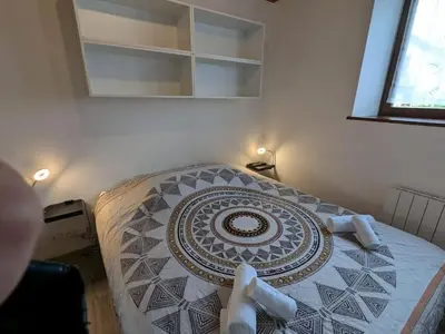 Un ou plusieurs lits dans un hébergement de l'établissement Appartement Ruby
