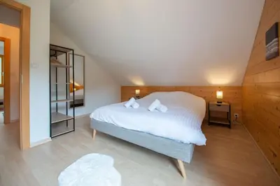 Un ou plusieurs lits dans un hébergement de l'établissement Chalet Sequoia - Spa et Sauna